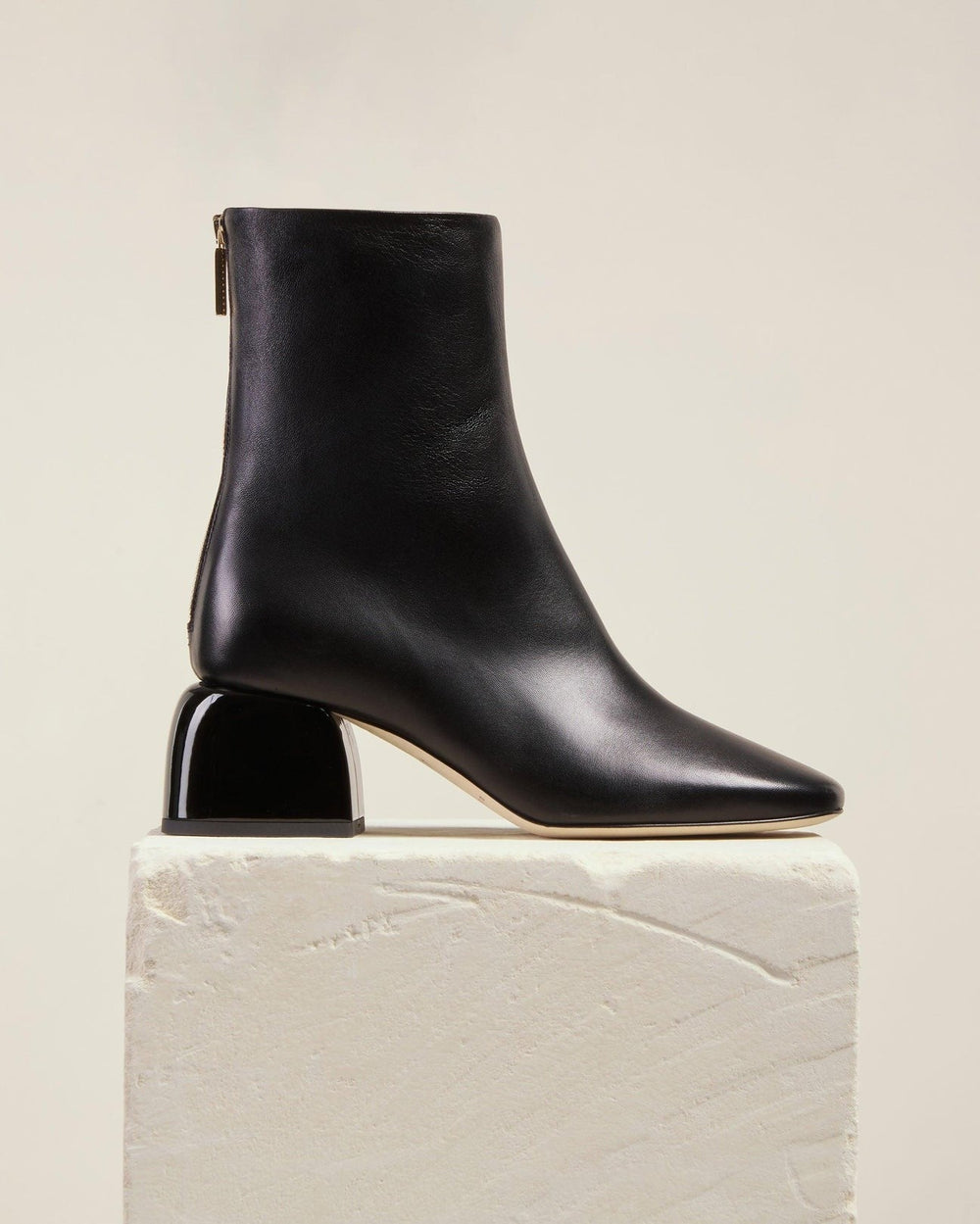 Smooth, sculptural and as soft as butter, our form-fitted ankle boot features a distinctive curved block heel, back zip closure and a unique asymmetric toe shape. Form is soft, supple and designed to an ideal mid-heel height for all day, all year wear.