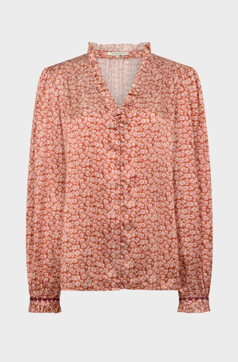 This pretty blouse features feminine ruffle details a the collar and wrists in a mood-lifting floral fabric from Liberty. The details make it truly special and it standouts beautifully with tailored denim or a flared skirt.