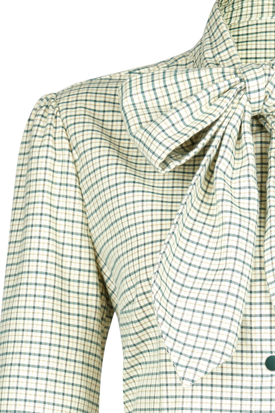 Vintage-inspired, this check shirt is designed with a tie to be worn knotted, bowed or loose. Softly billowed sleeves, long elegant cuffs and finished with faux suede buttons.