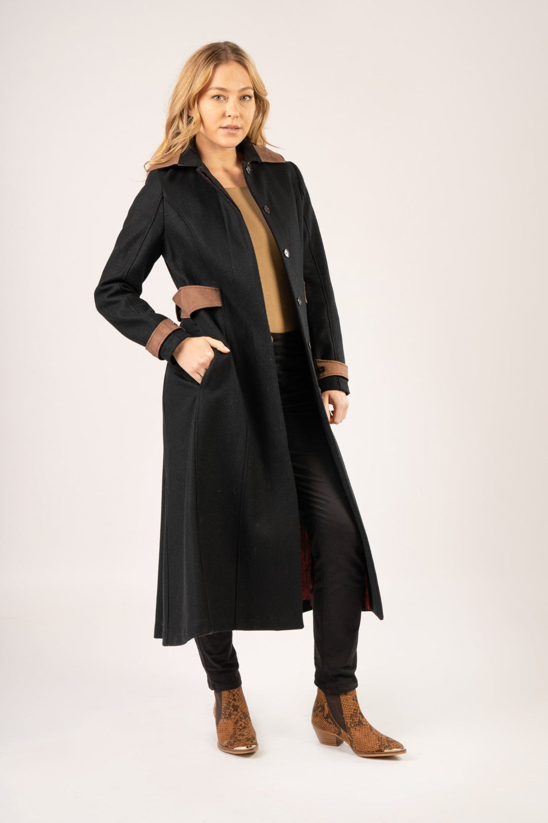 Our Elizabeth Wool Coat is back and this time in a rich navy with chocolate contrast details. Longer line for both warmth and elegance, our Elizabeth Wool Women's Coat is a timeless piece. With an adjustable belt feature you can bring the coat in to accentuate the female silhouette or to provide more freedom of movement when wearing extra layers.