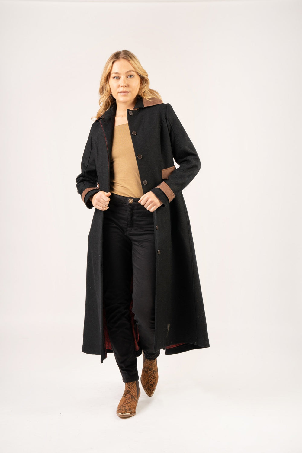 Our Elizabeth Wool Coat is back and this time in a rich navy with chocolate contrast details. Longer line for both warmth and elegance, our Elizabeth Wool Women's Coat is a timeless piece. With an adjustable belt feature you can bring the coat in to accentuate the female silhouette or to provide more freedom of movement when wearing extra layers.