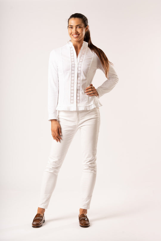 Our Phoebe White Frill Shirt is a one of our favourite pieces as they are a smart casual comfortable white shirt. The buttoned front shapes the shirt beautifully and the cotton stretch on the back and sides ensures ultimate comfort. The intricate lace detailing on the front and the frill to the cuff, collar and bottom is essentially feminine. Looks great under one of our wool jackets over jeans or tucked into a skirt.